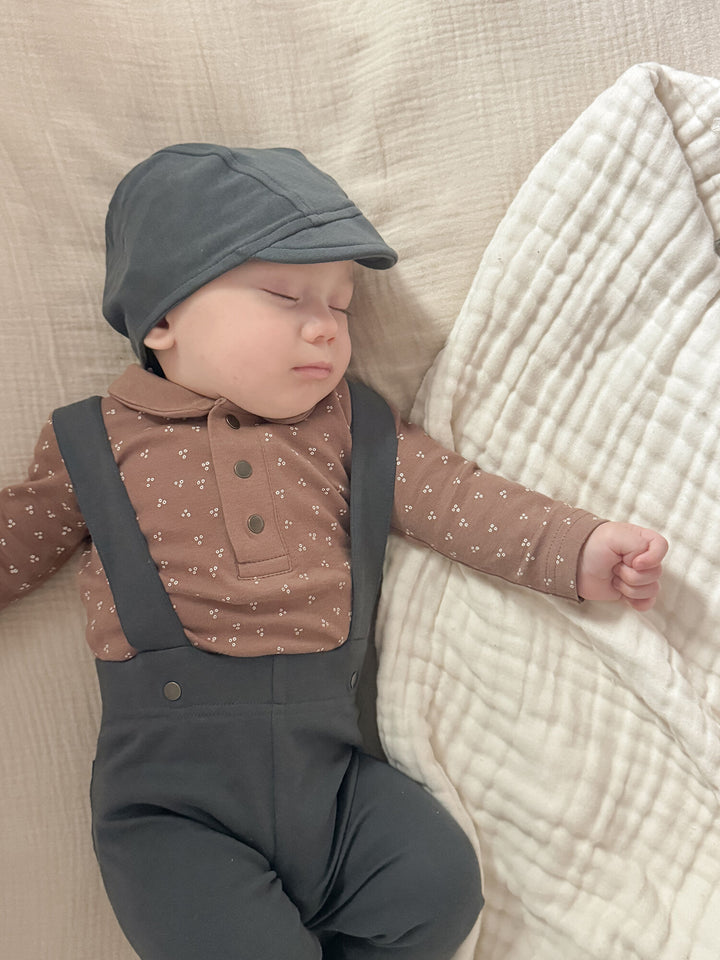 Child wearing Organic Riding Cap in Charcoal.