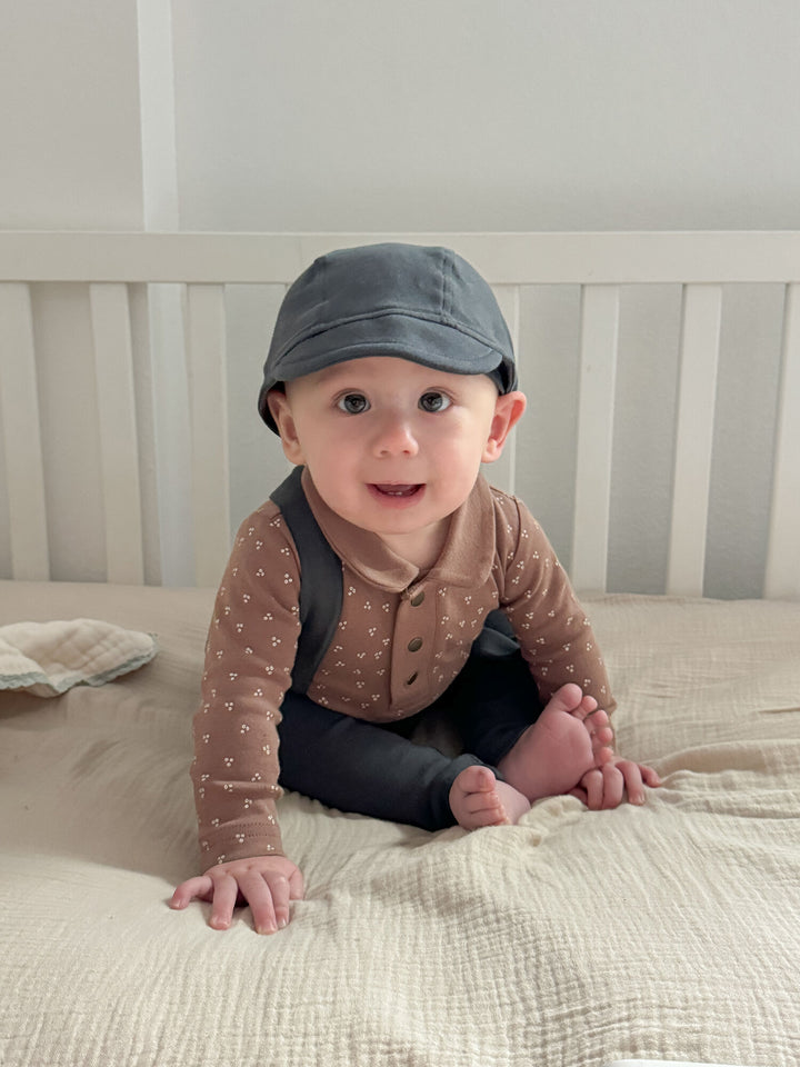 Child wearing Organic Riding Cap in Charcoal.