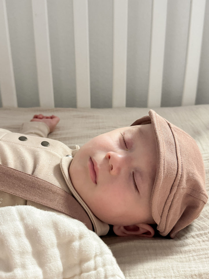 Child wearing Organic Riding Cap in Latte.