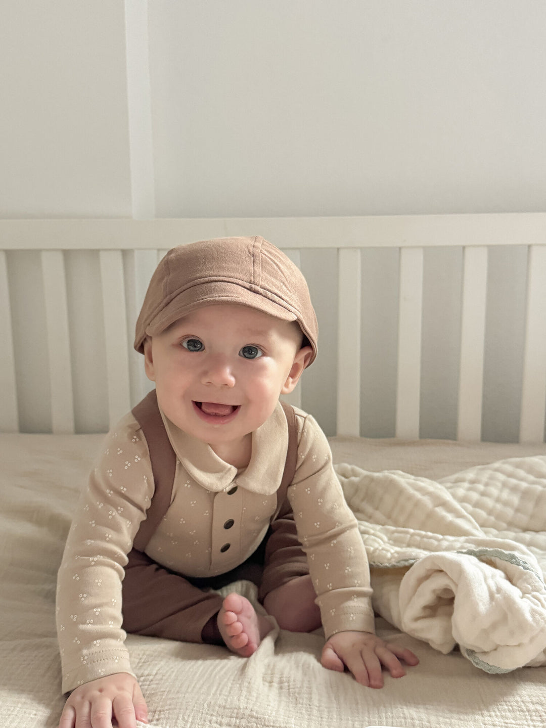 Child wearing Organic Riding Cap in Latte.