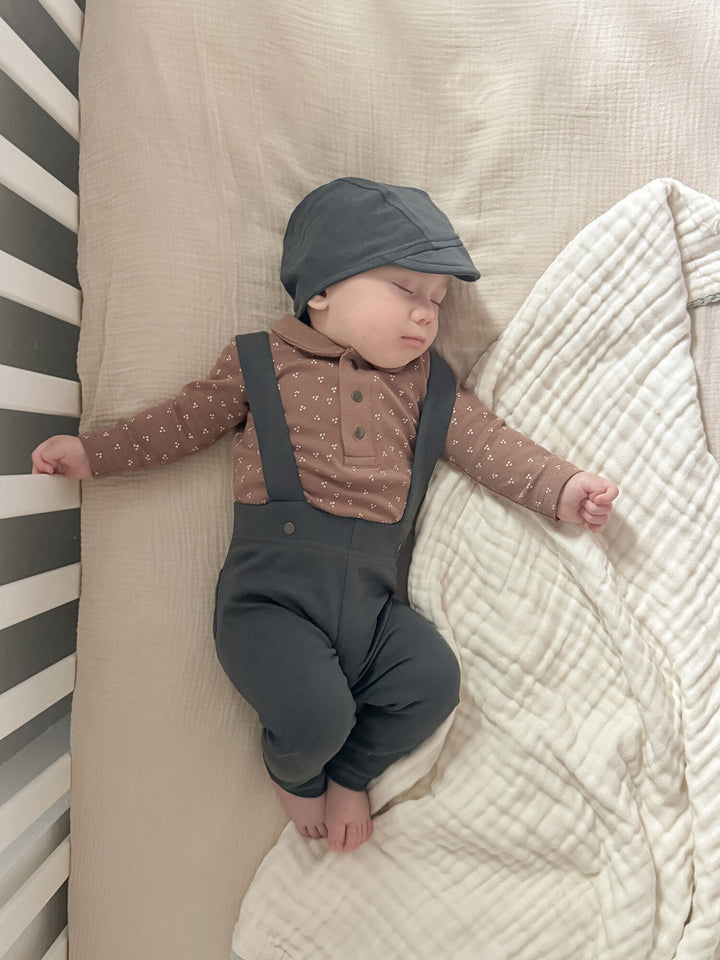 Child wearing Organic Suspender Pant in Charcoal.