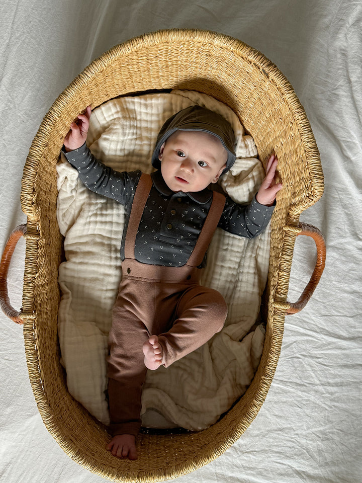 Child wearing Organic Suspender Pant in Latte.