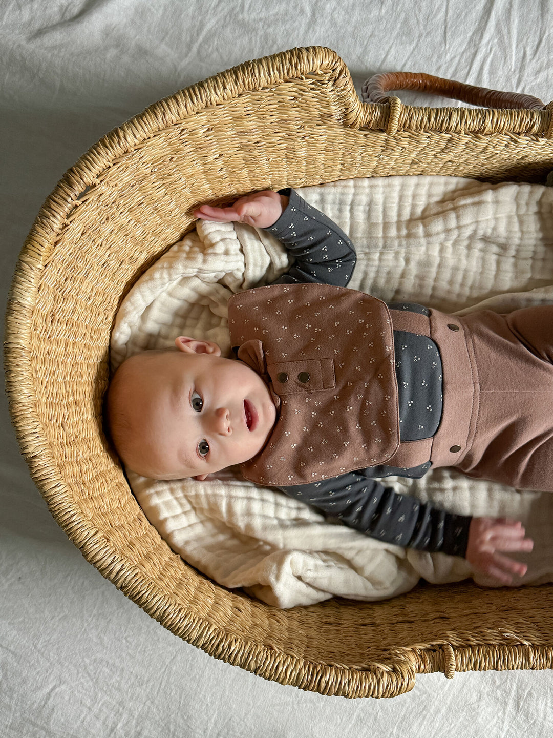 Child wearing Organic Double-Layer Bowtie Bib in Latte Dots.