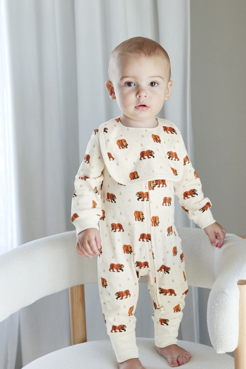 Child wearing Organic Footless 2-Way Zipper Romper in Brown Bear.