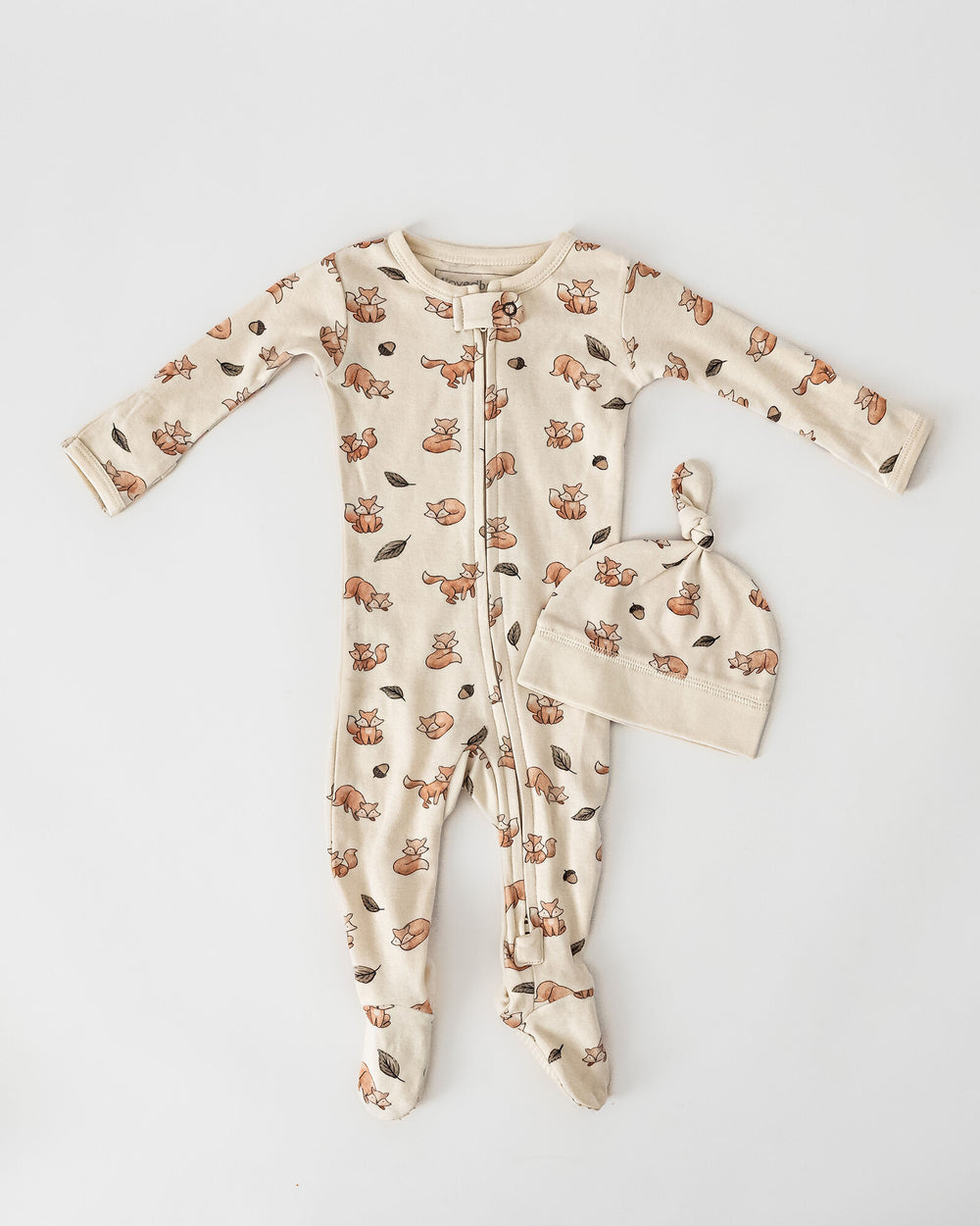 Child wearing Organic 2-Way Zipper Footie in Foxy.