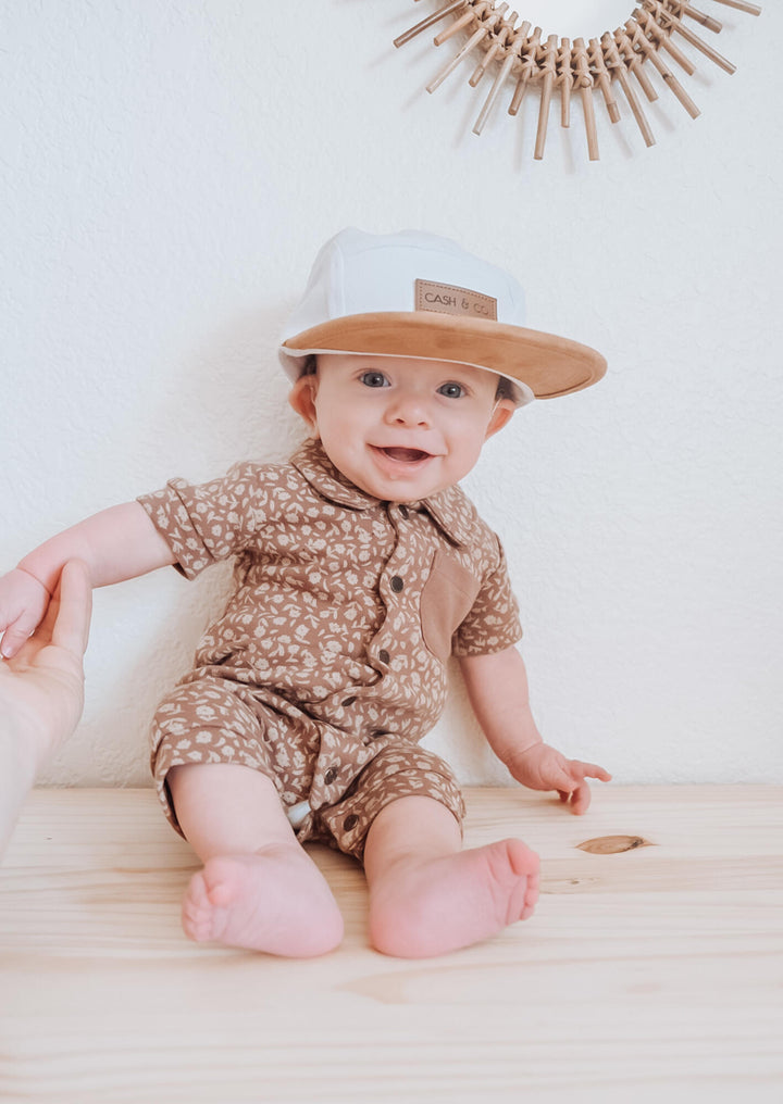 Child wearing Printed S/Sleeve Coverall in Latte Floral.