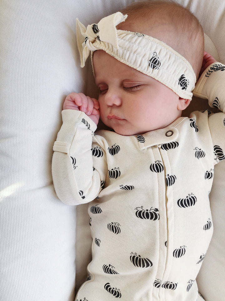 Child wearing Organic Smocked Headband in Enchanted Pumpkins.