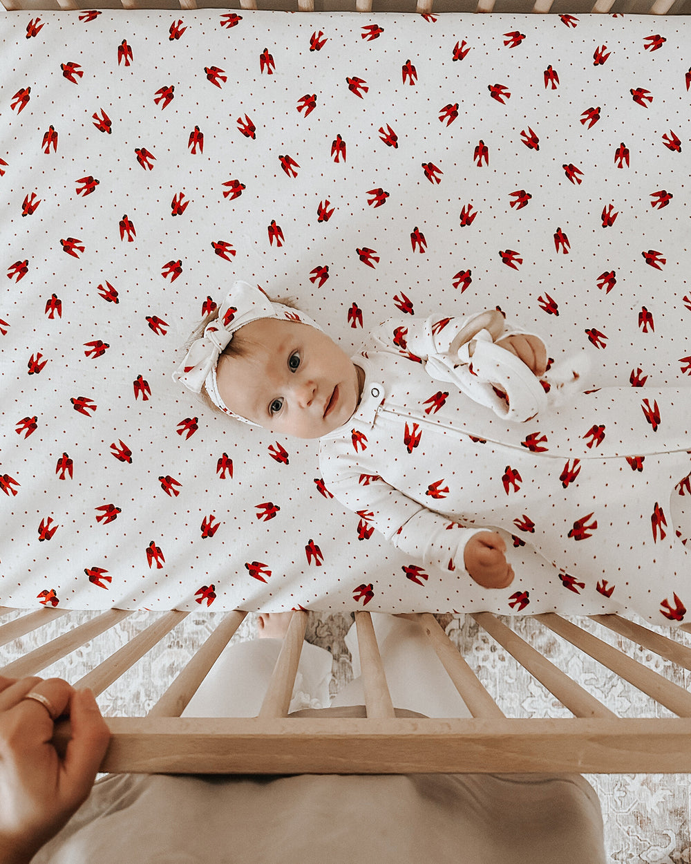 Child wearing Organic Smocked Headband in Red Bird.