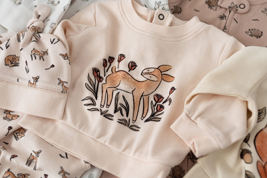 Child wearing Organic Sweatshirt & Jogger Set in Doe-a-Deer.