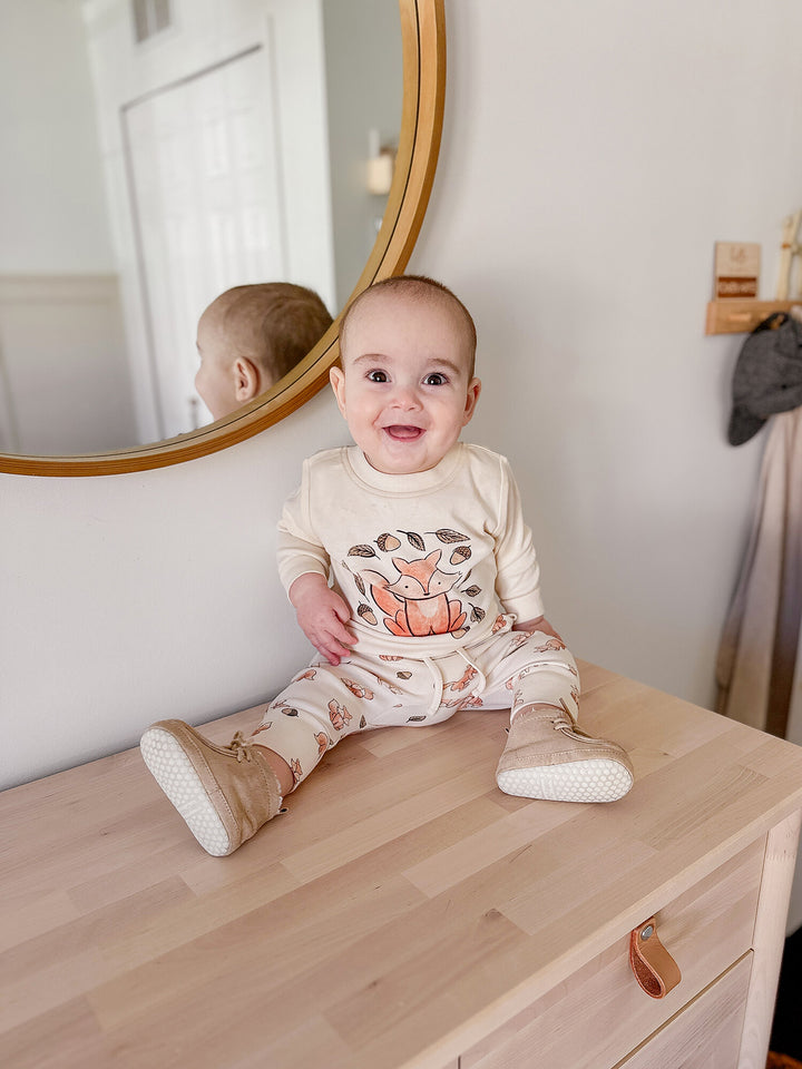 Child wearing Organic Sweatshirt & Jogger Set in Foxy.