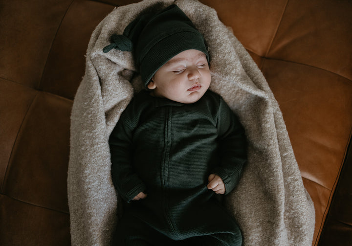 Child wearing Organic Thermal Knotted Cap in Evergreen.