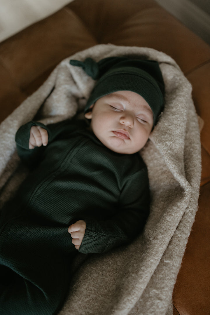 Child wearing Organic Thermal Knotted Cap in Evergreen.