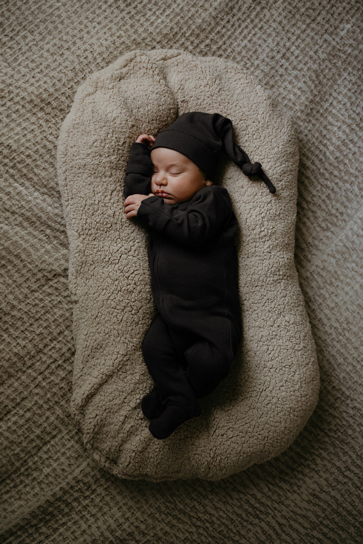 Child wearing Organic Thermal 2-Way Zipper Footie in Black.