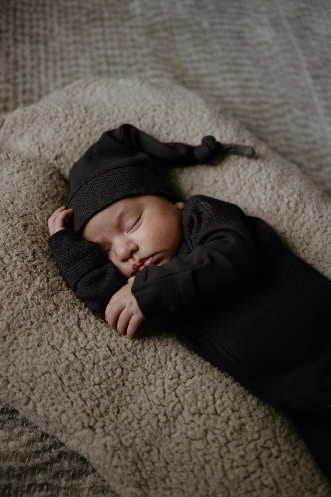 Child wearing Organic Thermal 2-Way Zipper Footie in Black.