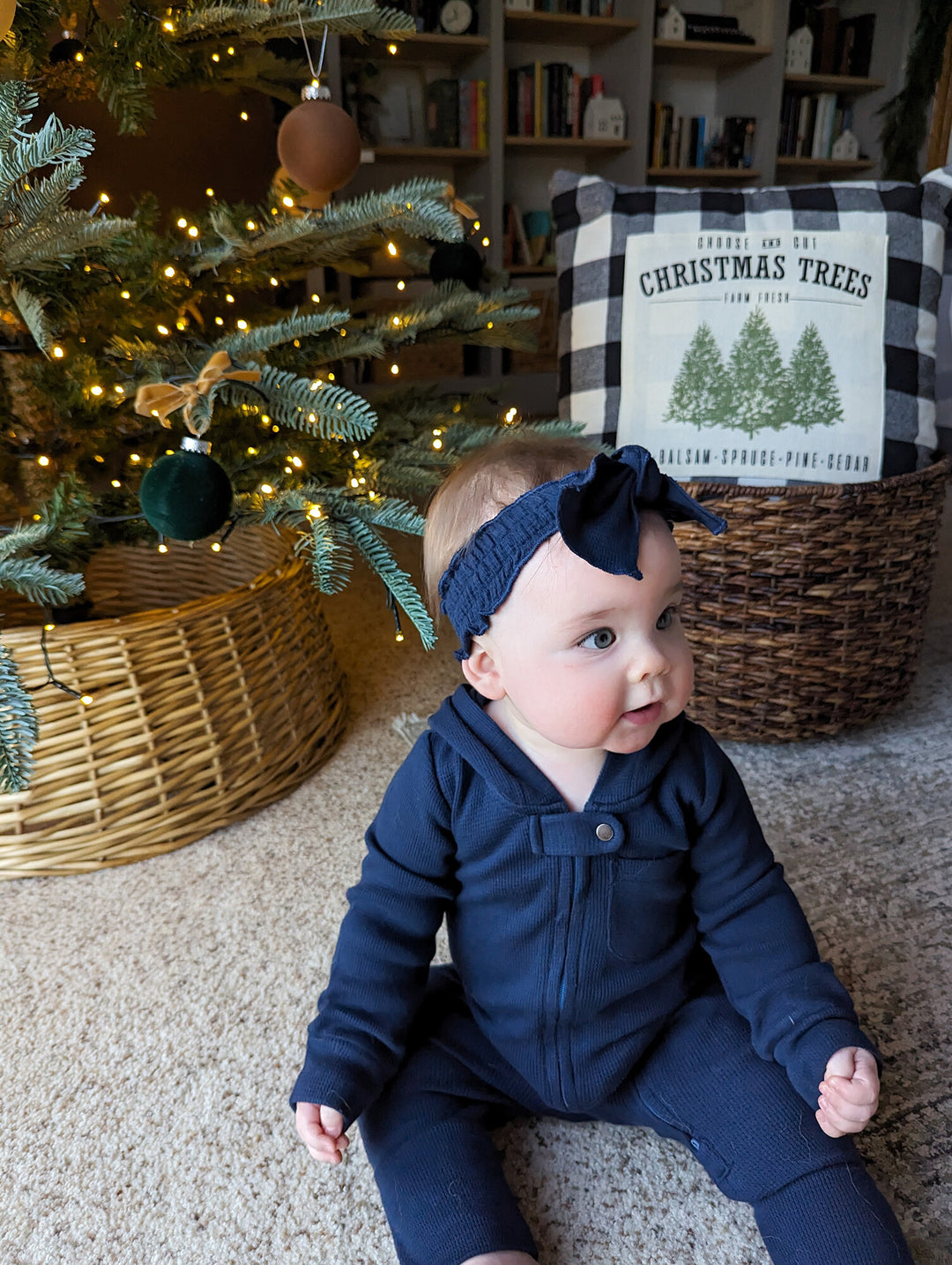 Child wearing Organic Thermal Smocked Headband in Midnight.