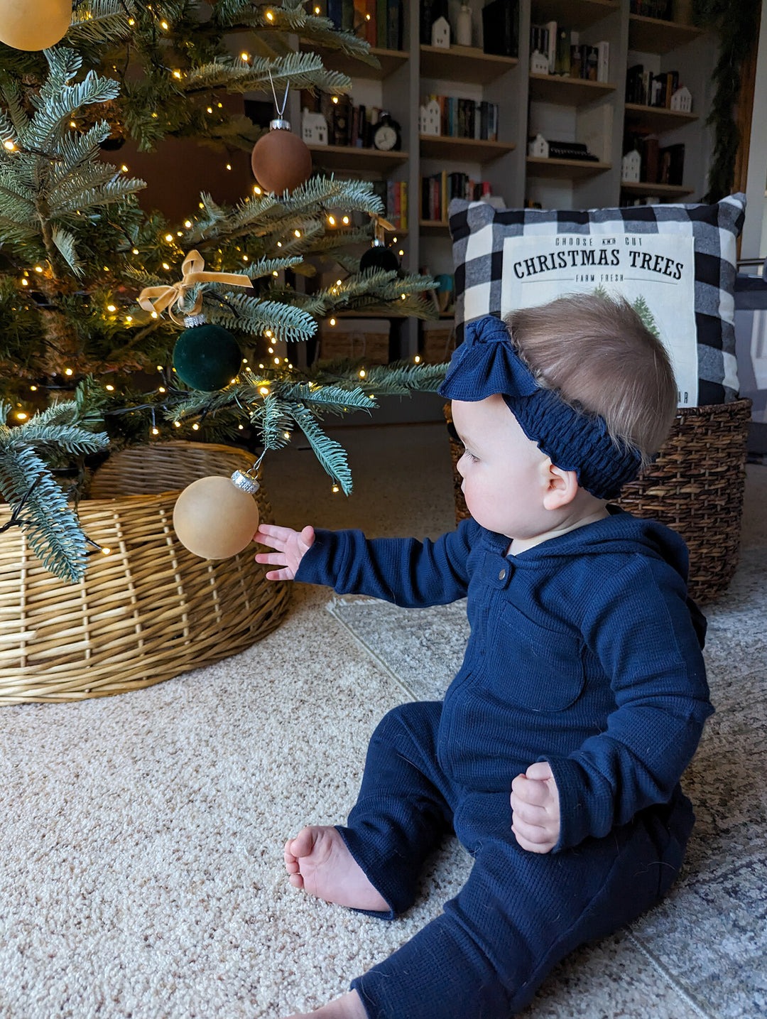 Child wearing Organic Thermal Smocked Headband in Midnight.