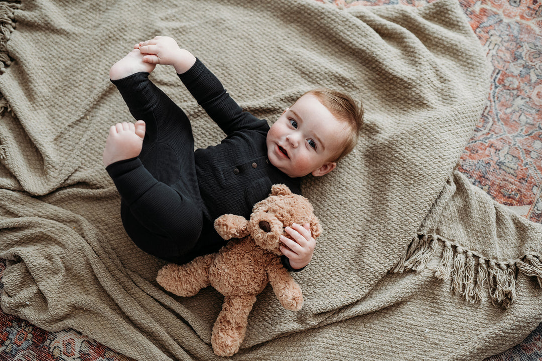 Child wearing Organic Thermal Henley & Jogger Set in Black.