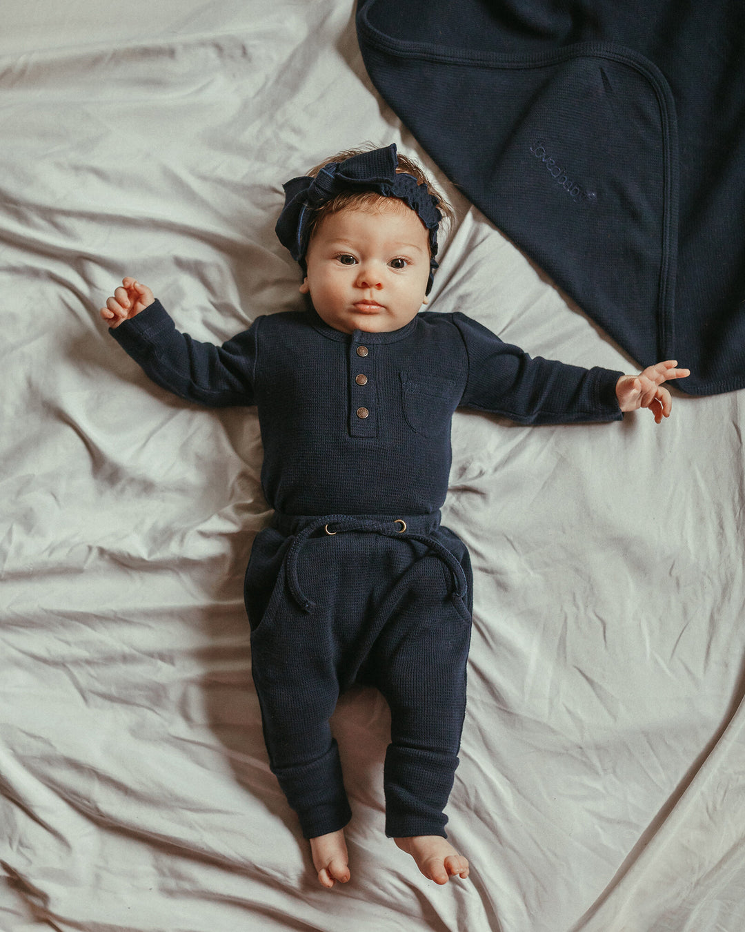 Child wearing Organic Thermal Henley & Jogger Set in Midnight.