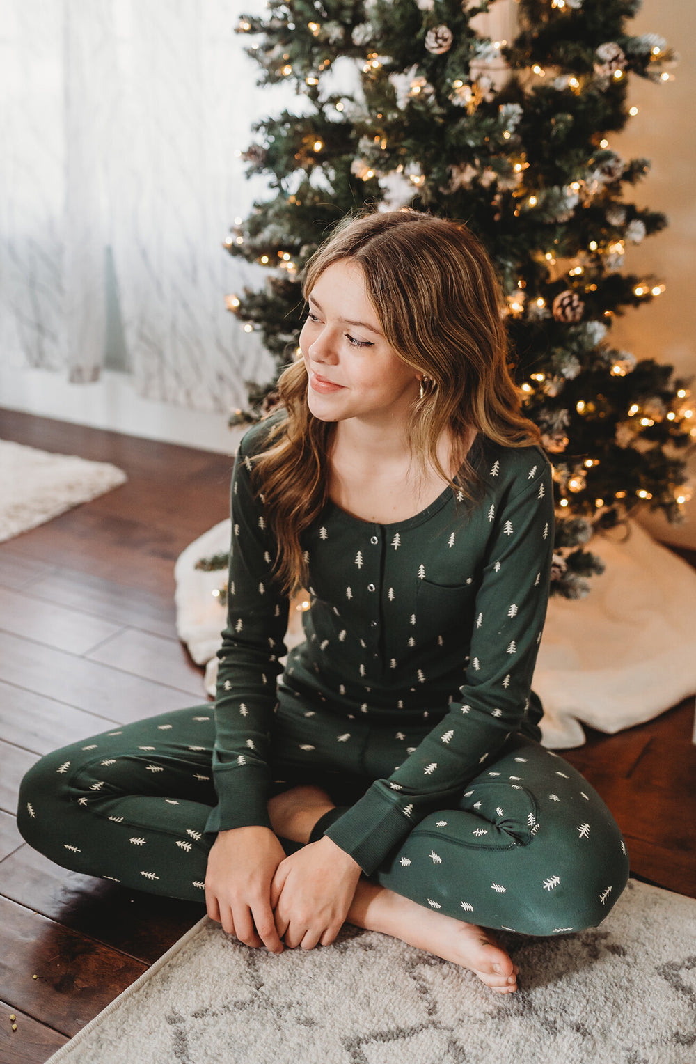 Child wearing Women's Organic Holiday 2-Pc Lounge Set with Cap in Pine Trees.