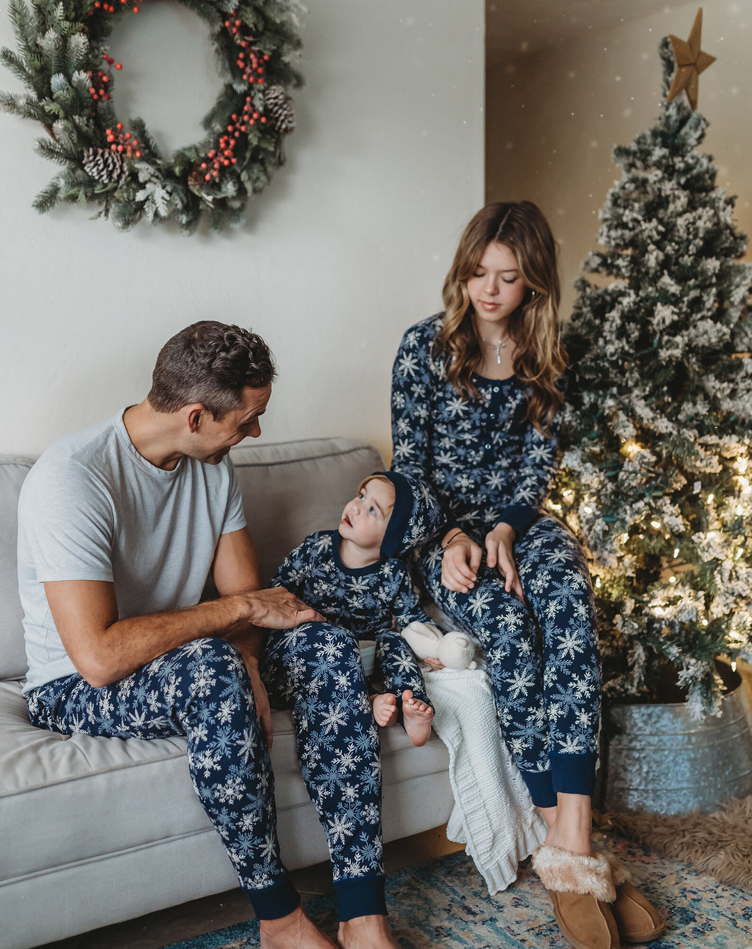 Child wearing Women's Organic Holiday 2-Pc Lounge Set with Cap in Snowflakes.