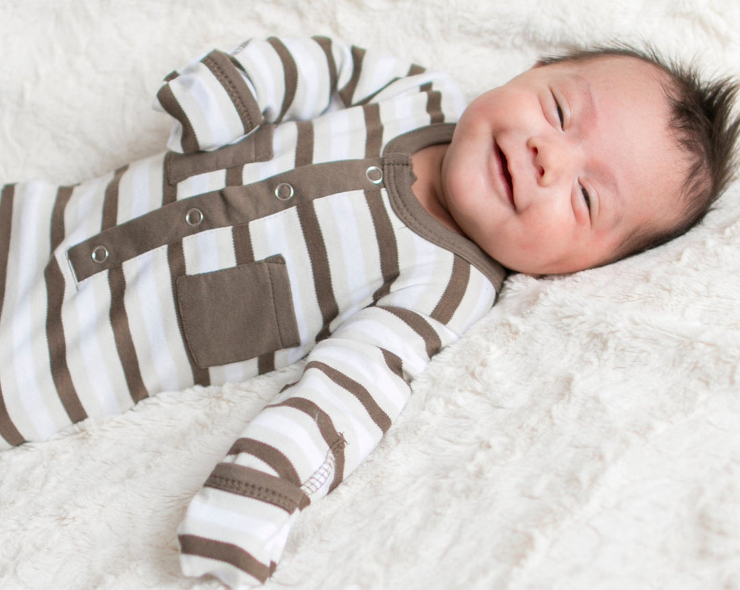 Child wearing Organic Gown in Bark Stripe.