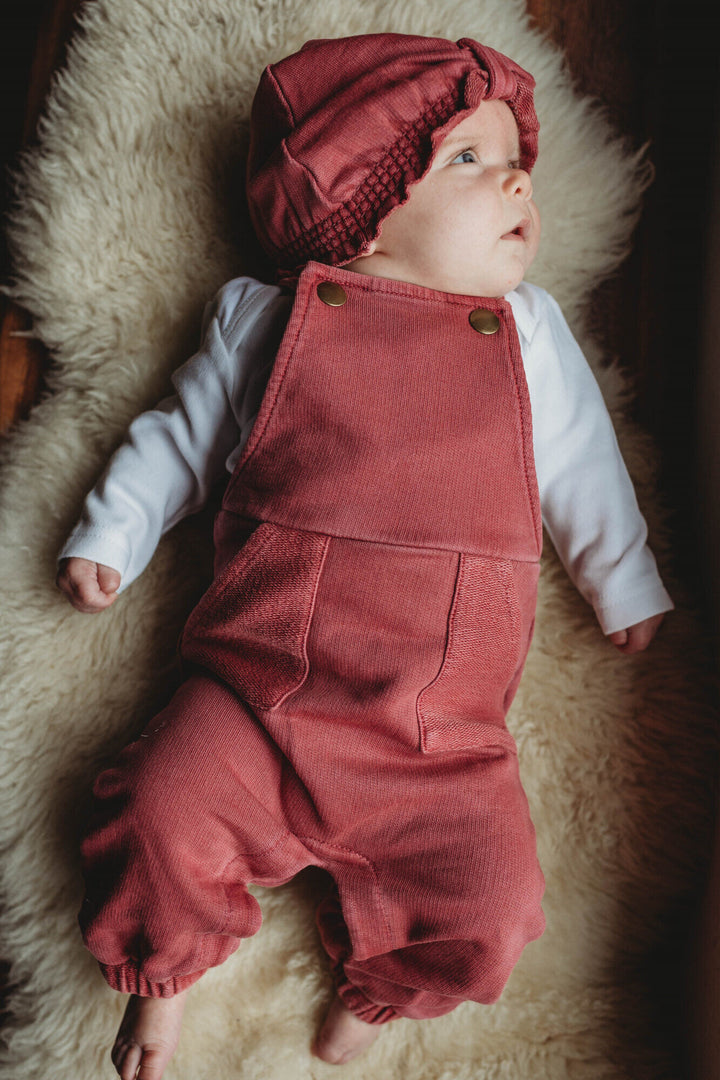 Child wearing French Terry Knotted Turban in Appleberry.