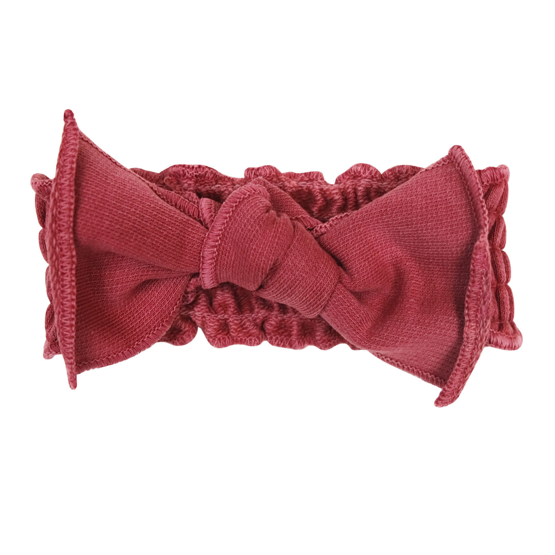 French Terry Smocked Headband in Appleberry, a dark, dusky pink color.