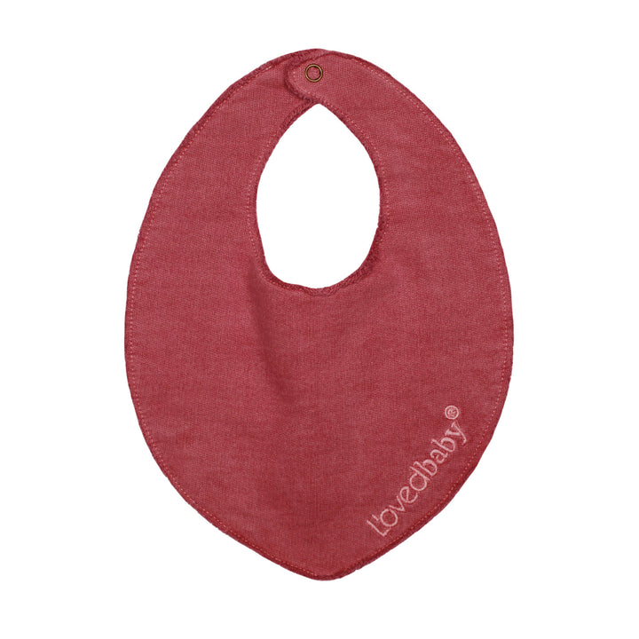 French Terry Reversible Bib in Appleberry, a dark, dusky pink color.