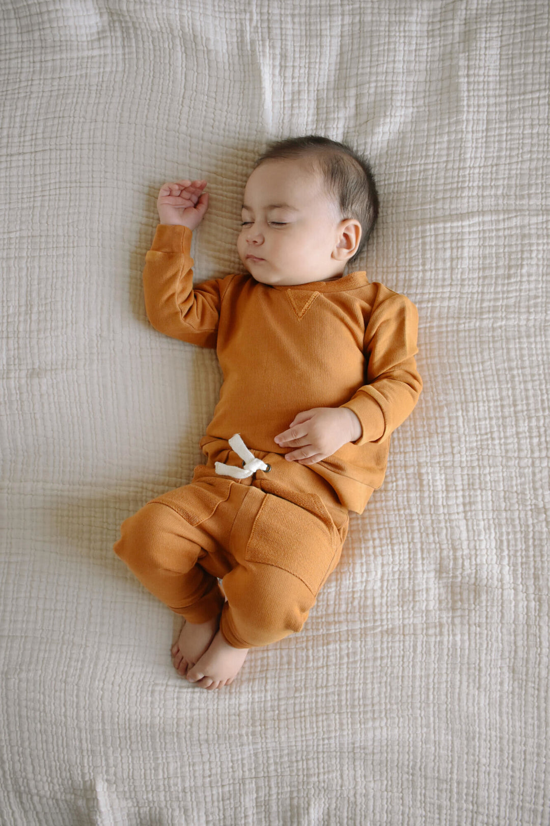 Child wearing French Terry Sweatshirt & Jogger Set in Butterscotch.