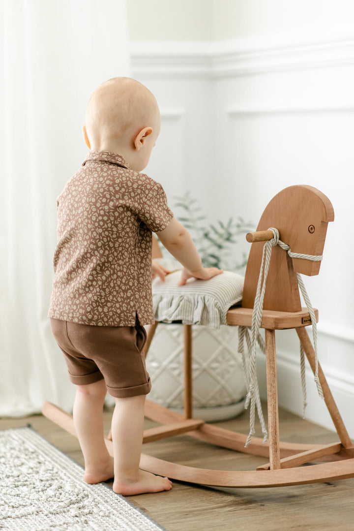 Child wearing Kids' Cuffed Shorts in Latte.