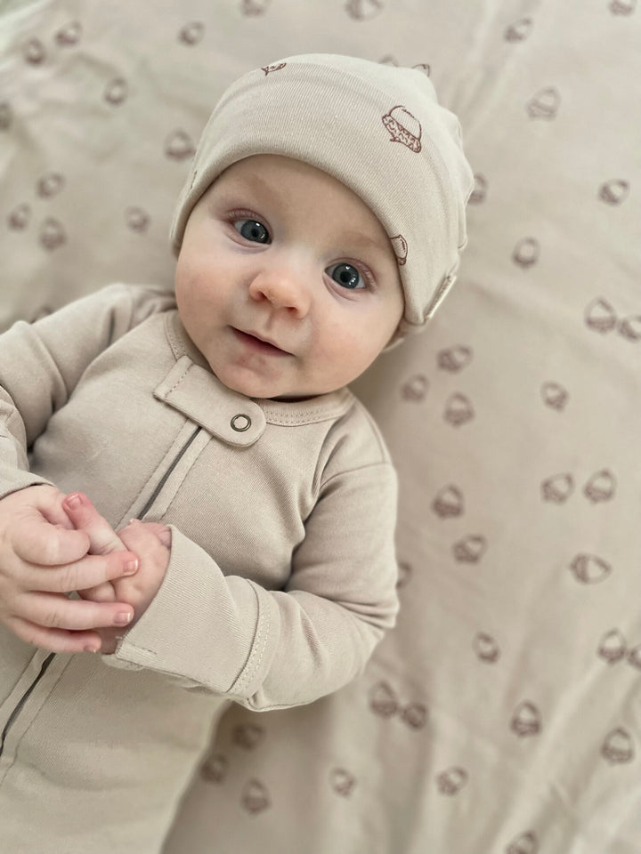 Child wearing Reversible Beanie in Oatmeal.