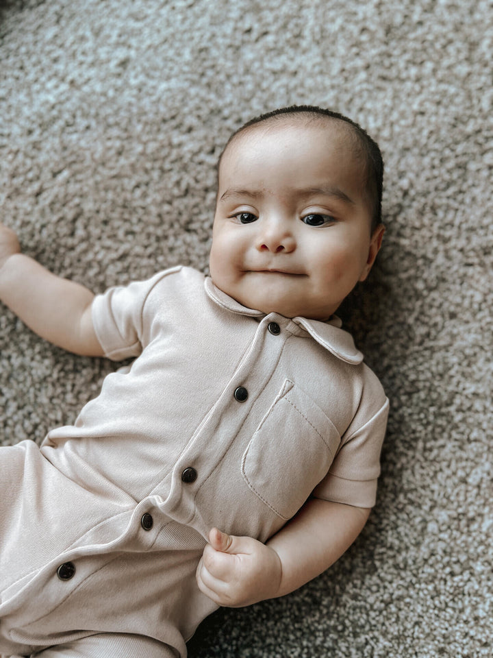 Child wearing S/Sleeve Coverall in Oatmeal.