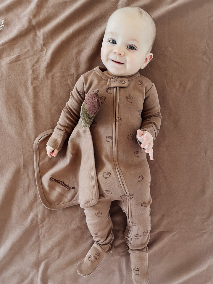 Child wearing Organic Cotton Lovey in Latte.