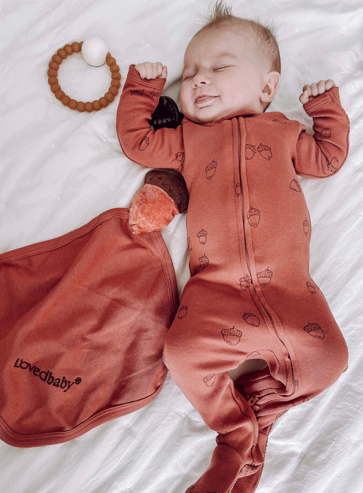 Child wearing Organic Cotton Lovey in Spice.