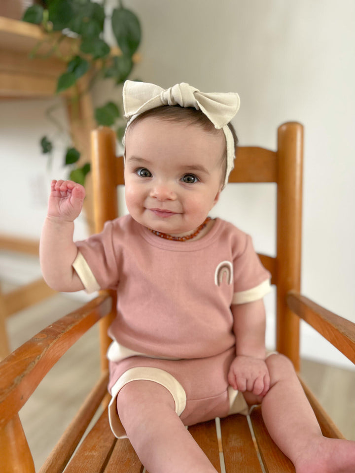 Child wearing Organic Embroidered Tee & Shortie Set in Mauve Rainbow.