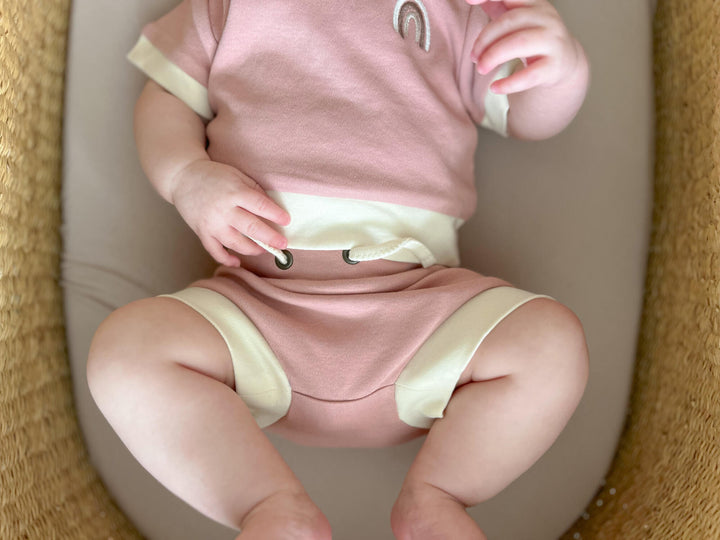 Child wearing Organic Embroidered Tee & Shortie Set in Mauve Rainbow.