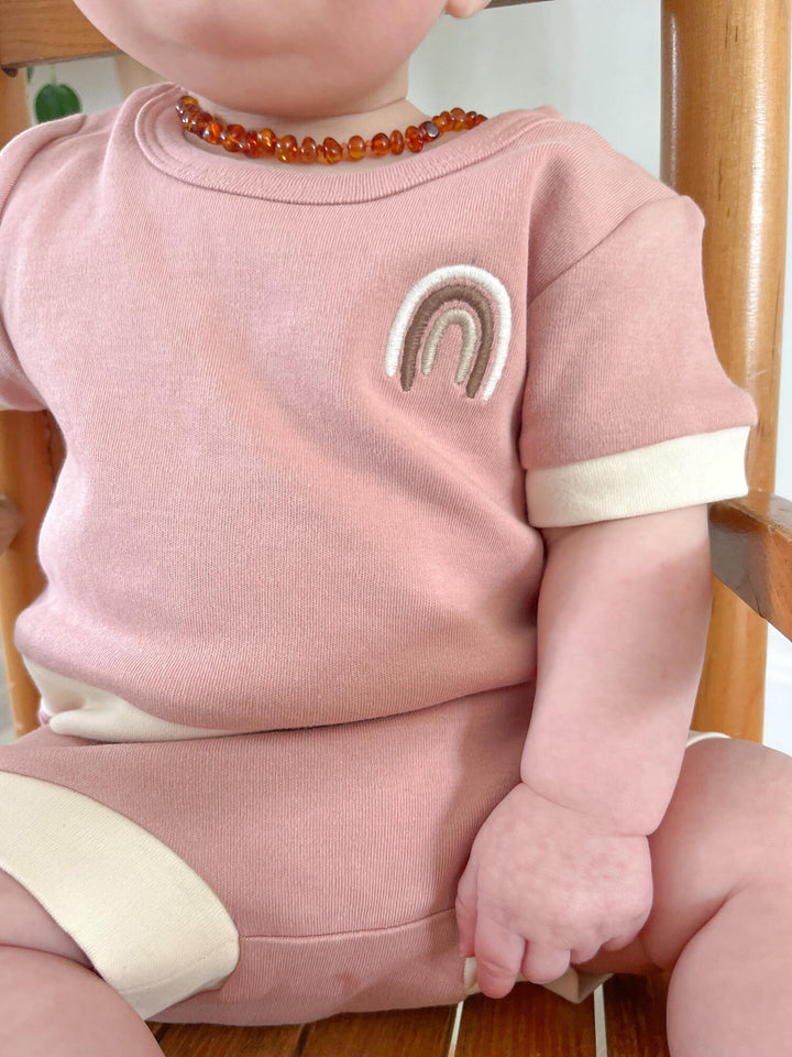 Child wearing Organic Embroidered Tee & Shortie Set in Mauve Rainbow.