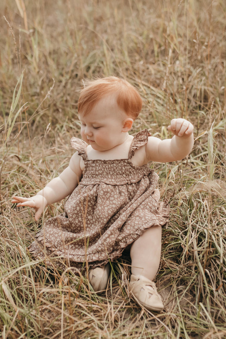 Child wearing Printed Smocked Summer Dress in Latte Floral.