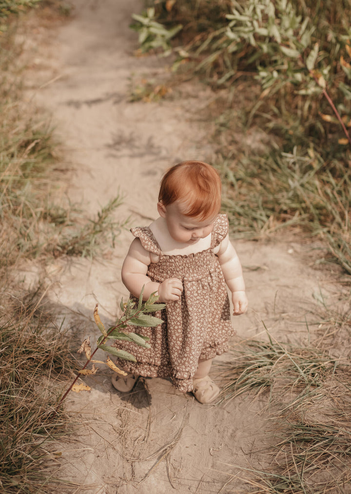 Child wearing Printed Smocked Summer Dress in Latte Floral.