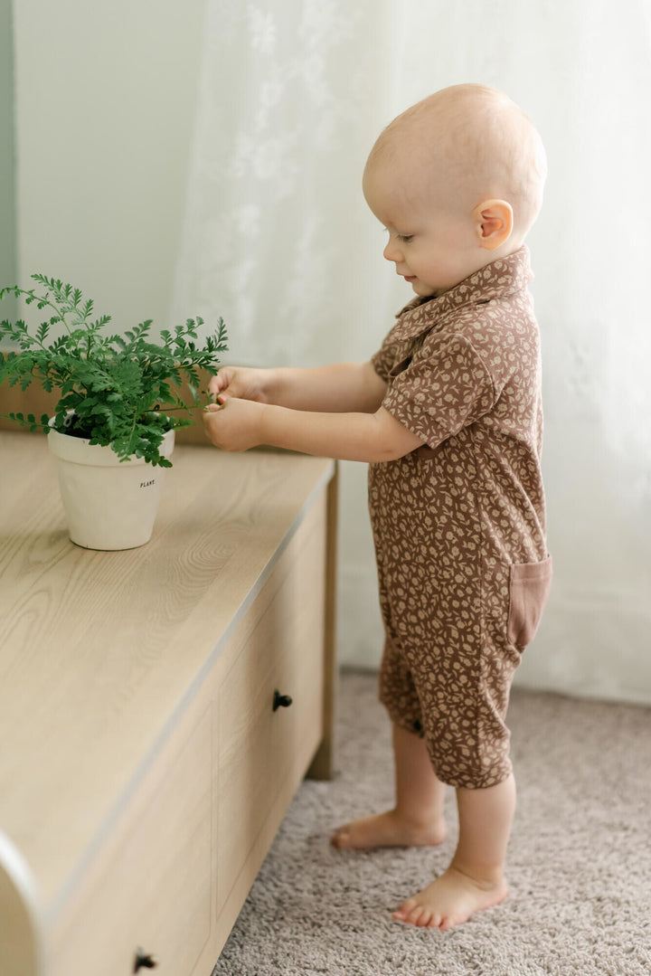 Child wearing Printed S/Sleeve Coverall in Latte Floral.