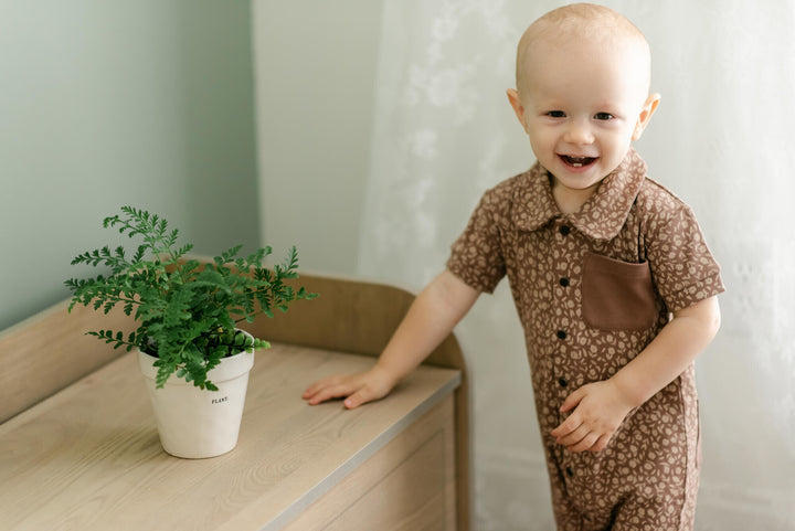 Child wearing Printed S/Sleeve Coverall in Latte Floral.