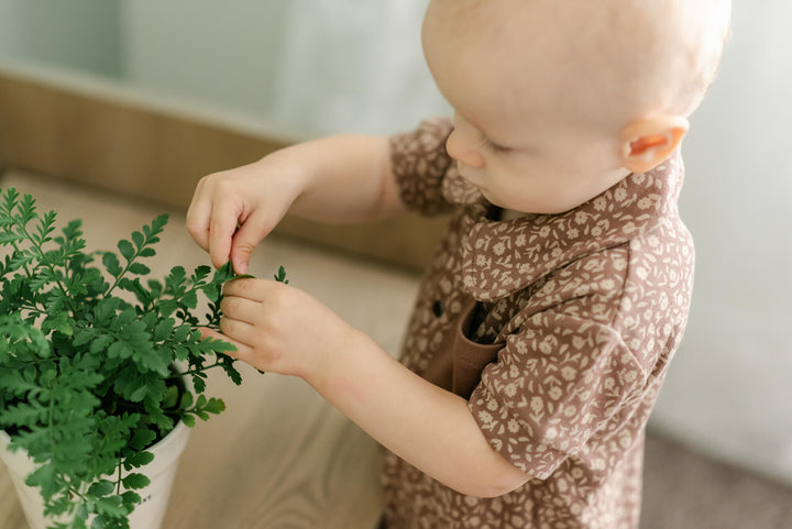 Child wearing Printed S/Sleeve Coverall in Latte Floral.