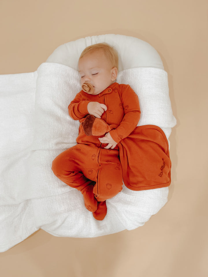 Child wearing Organic Cotton Lovey in Spice.