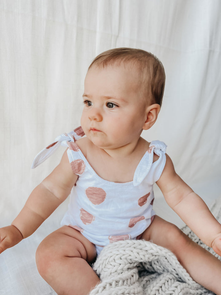 Child wearing Slub Jersey Bodysuit in Adobe Dot.