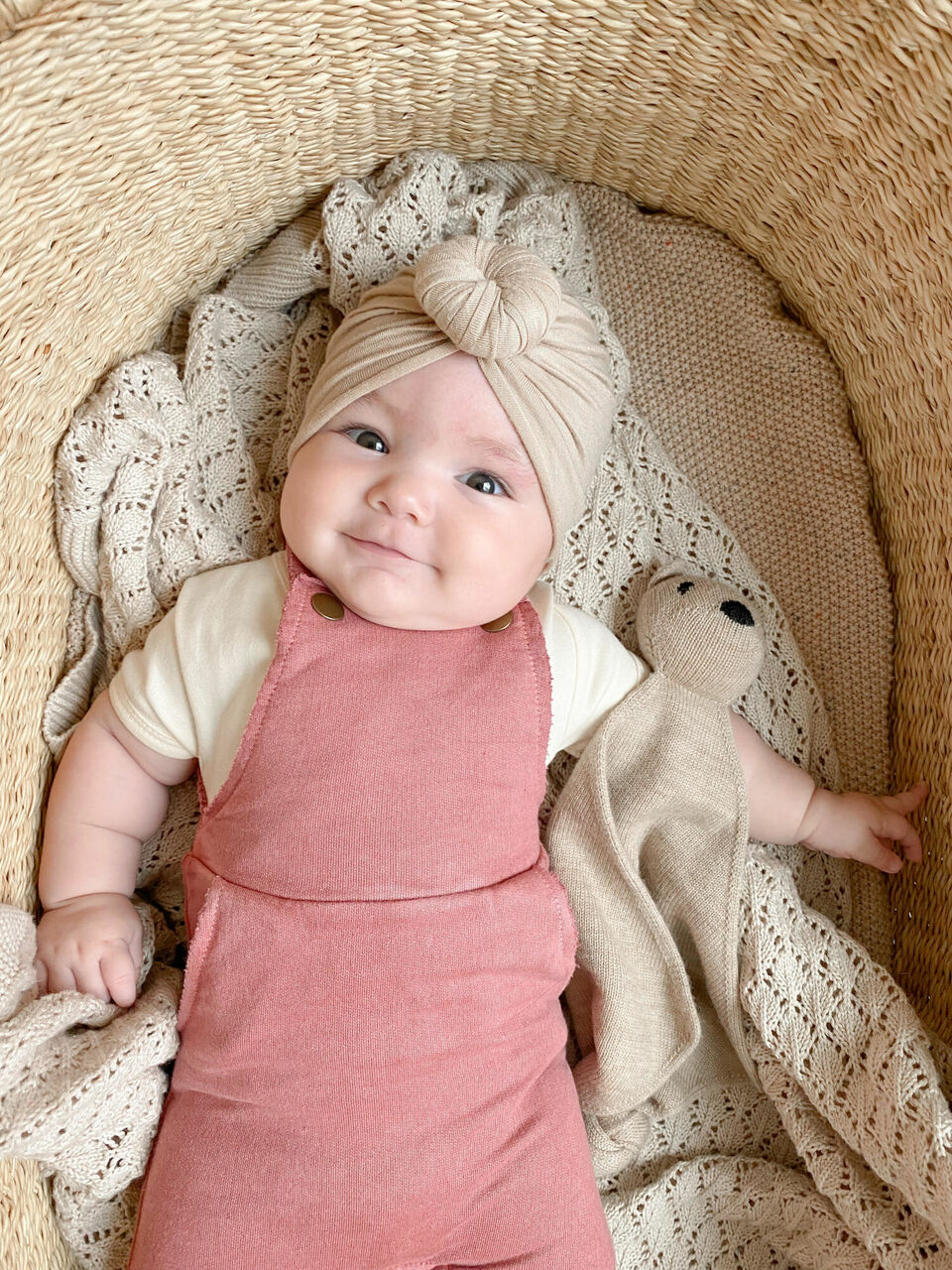 Child wearing French Terry Overall Romper in Sienna.