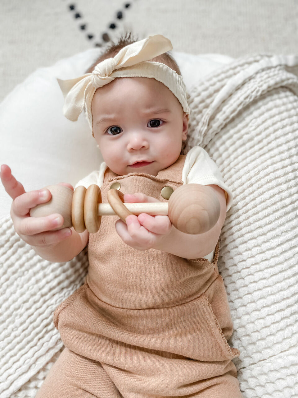 Child wearing French Terry Overall Romper in Adobe.