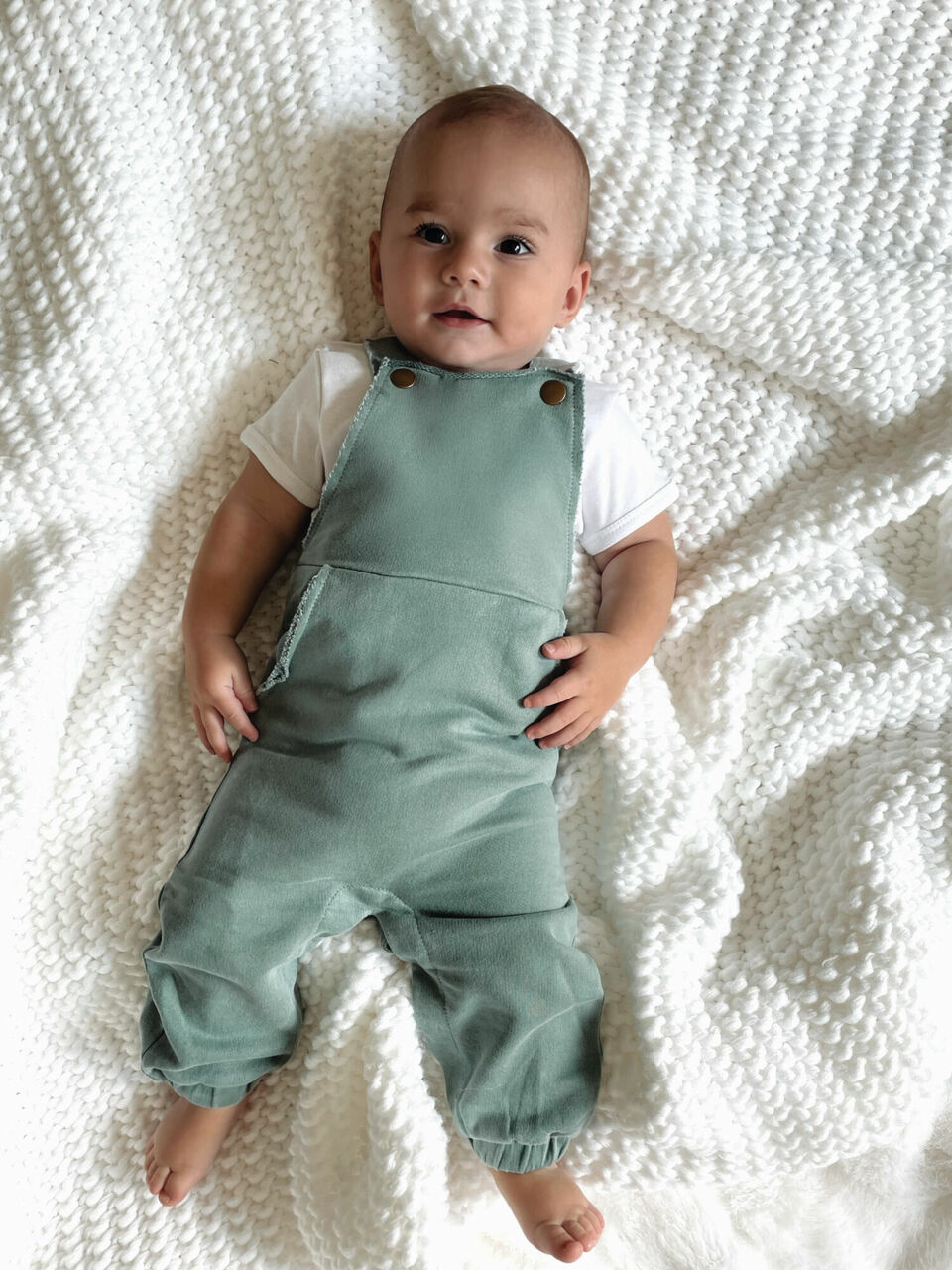 Child wearing French Terry Overall Romper in Jade.