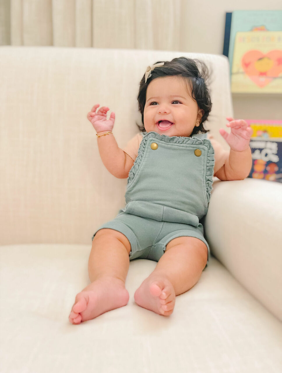 Child wearing French Terry Ruffle Romper in Jade.