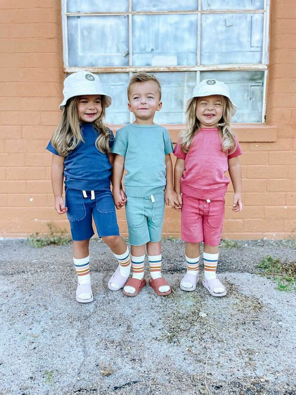 Child wearing Kids' French Terry Shorts & Tee Set in Indigo.