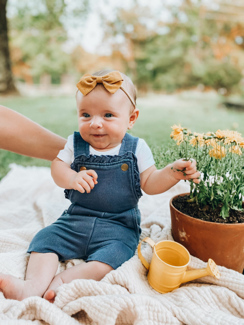 Child wearing French Terry Ruffle Romper in Indigo.